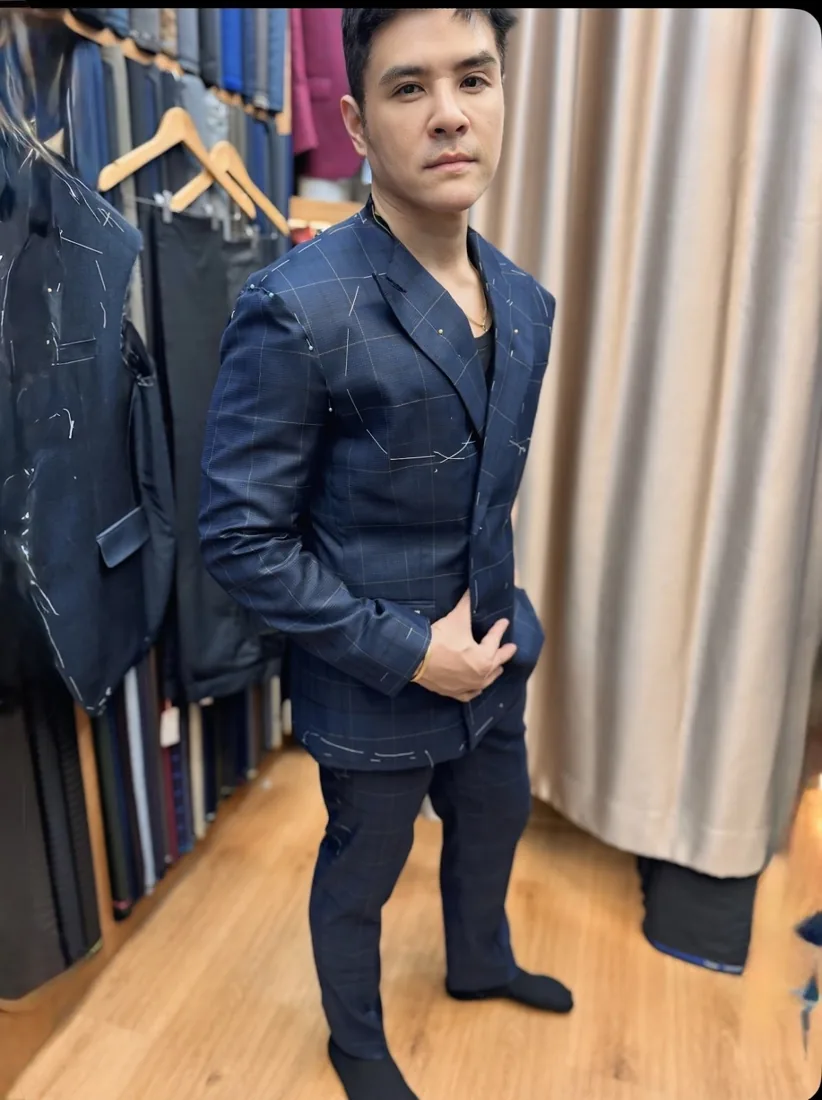 Client in a navy double-breasted suit