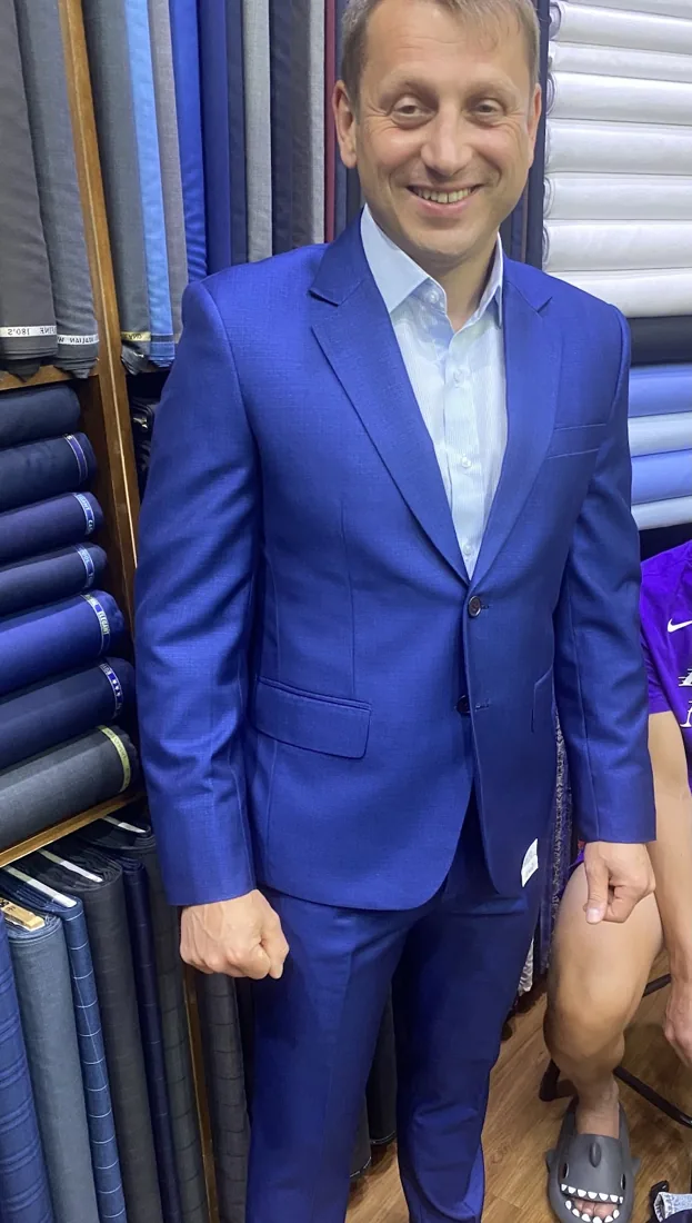 Client in a light-grey bespoke suit