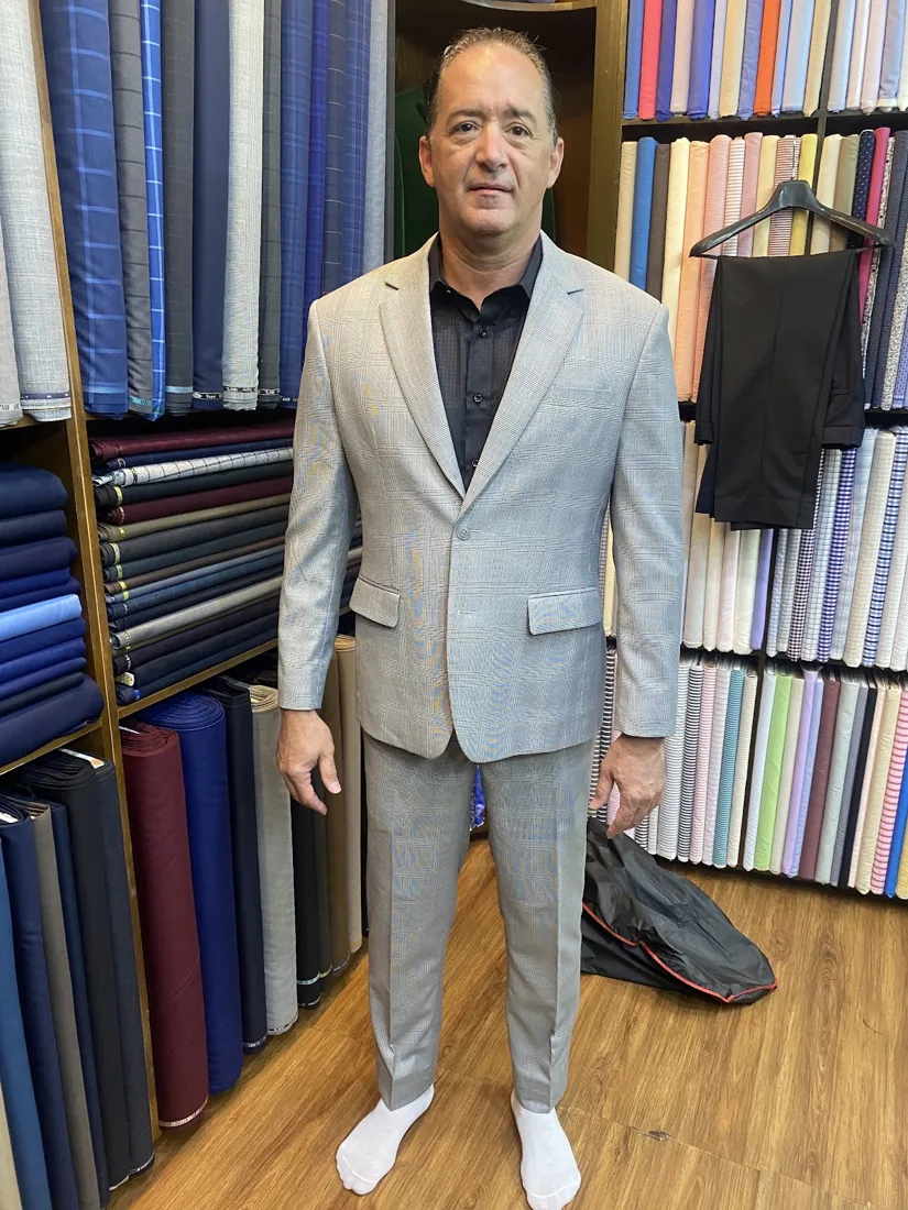 Client in a pale-grey custom suit