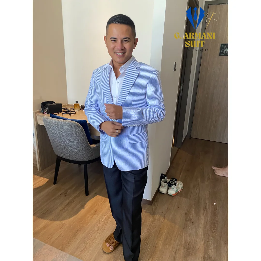 Client in a powder-blue tailored blazer
