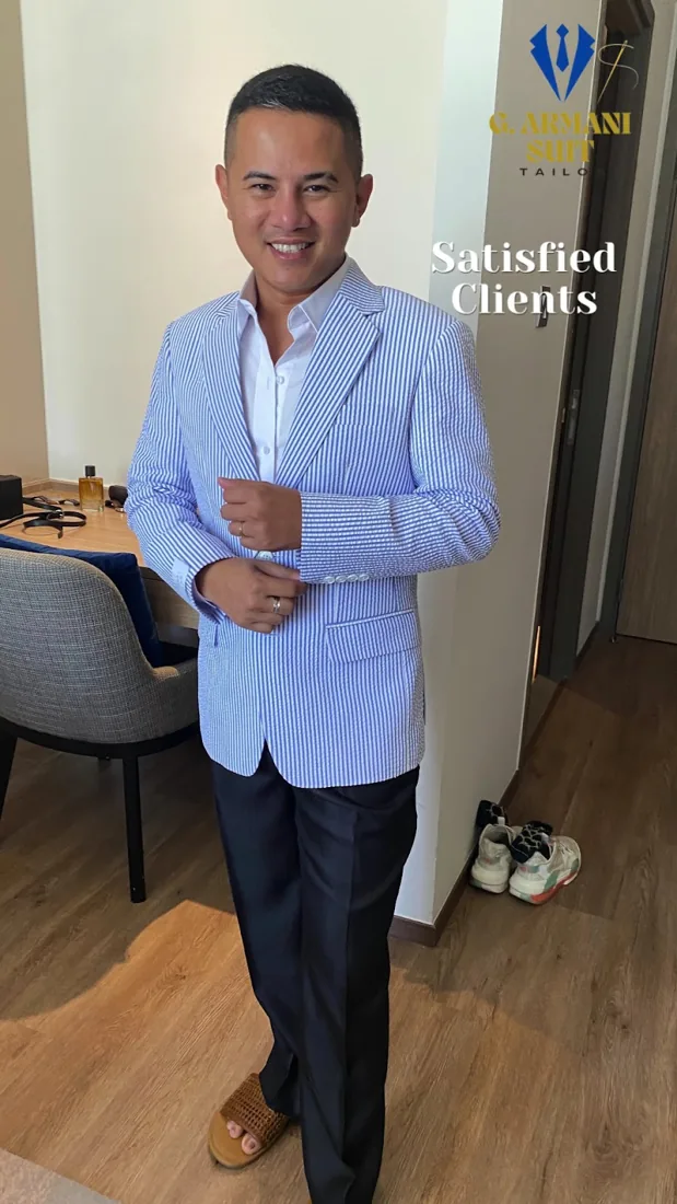 Client in a pale-blue tailored blazer