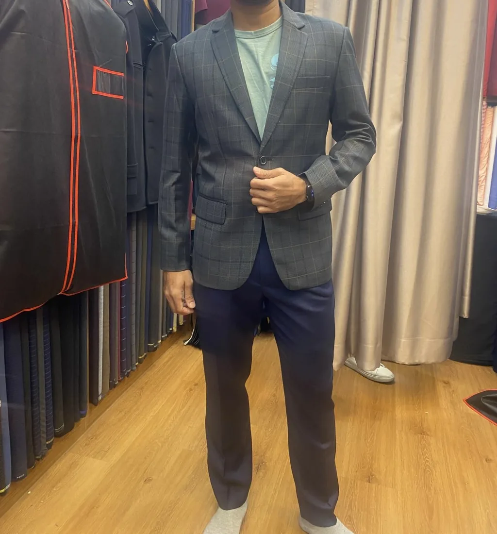 Client in a grey tailored blazer