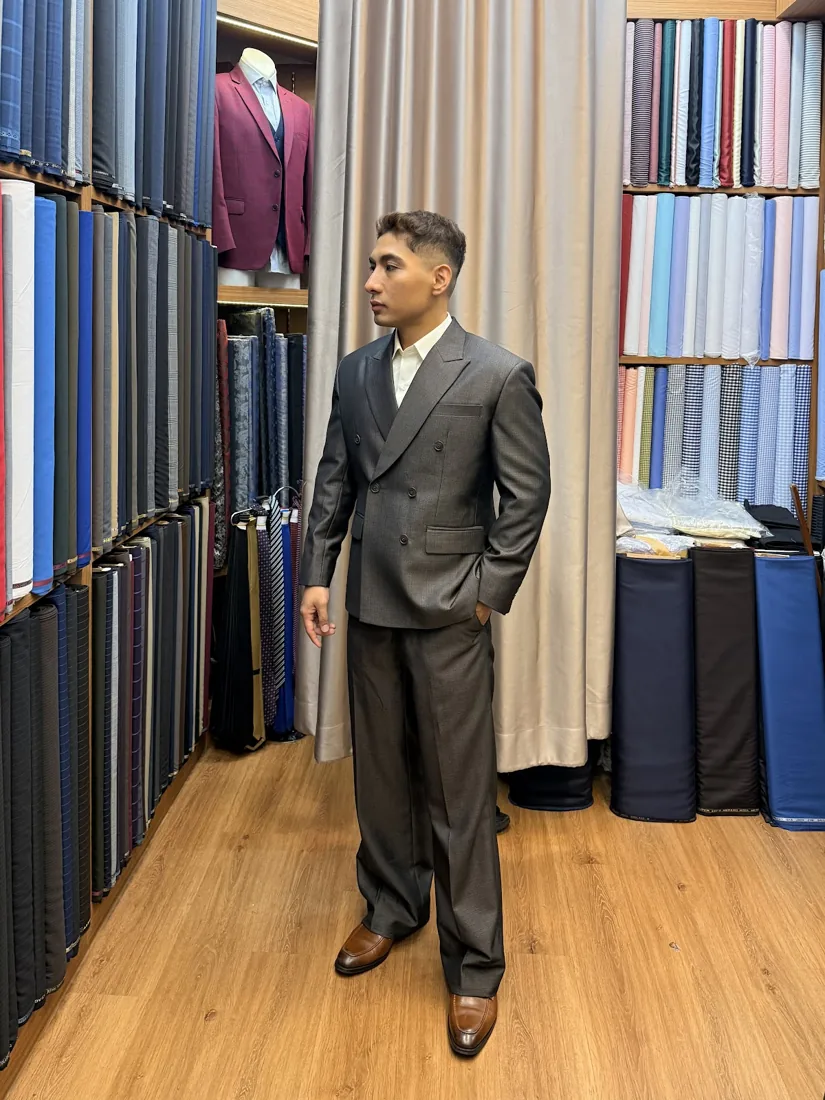 Client in a charcoal tailored suit