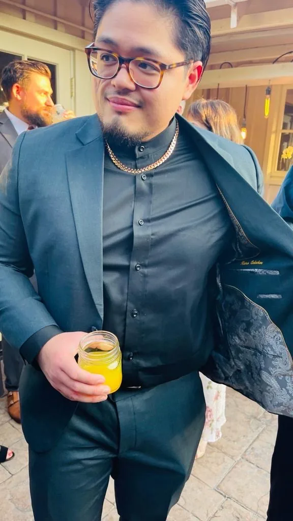 Client in a teal made-to-measure suit