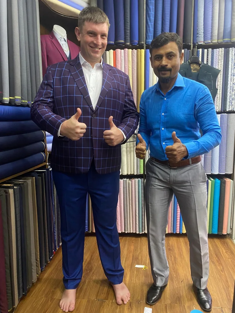 Clients in blue check tailored suits
