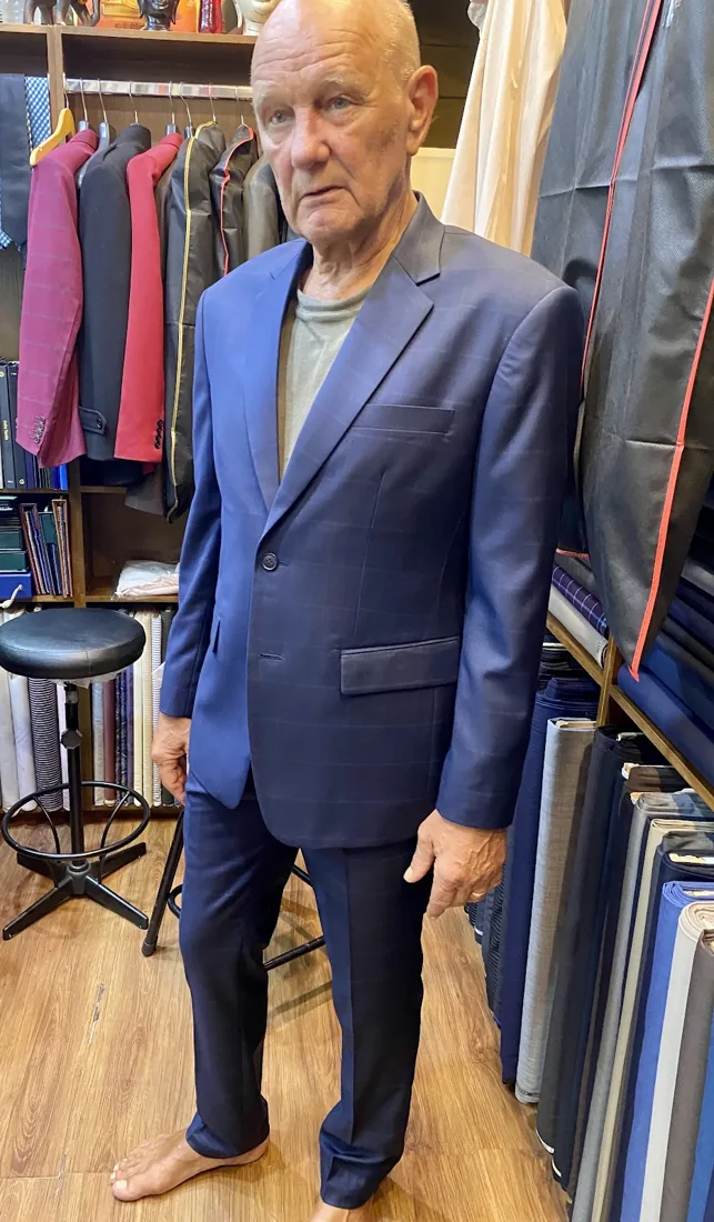 Client in a light-blue summer suit