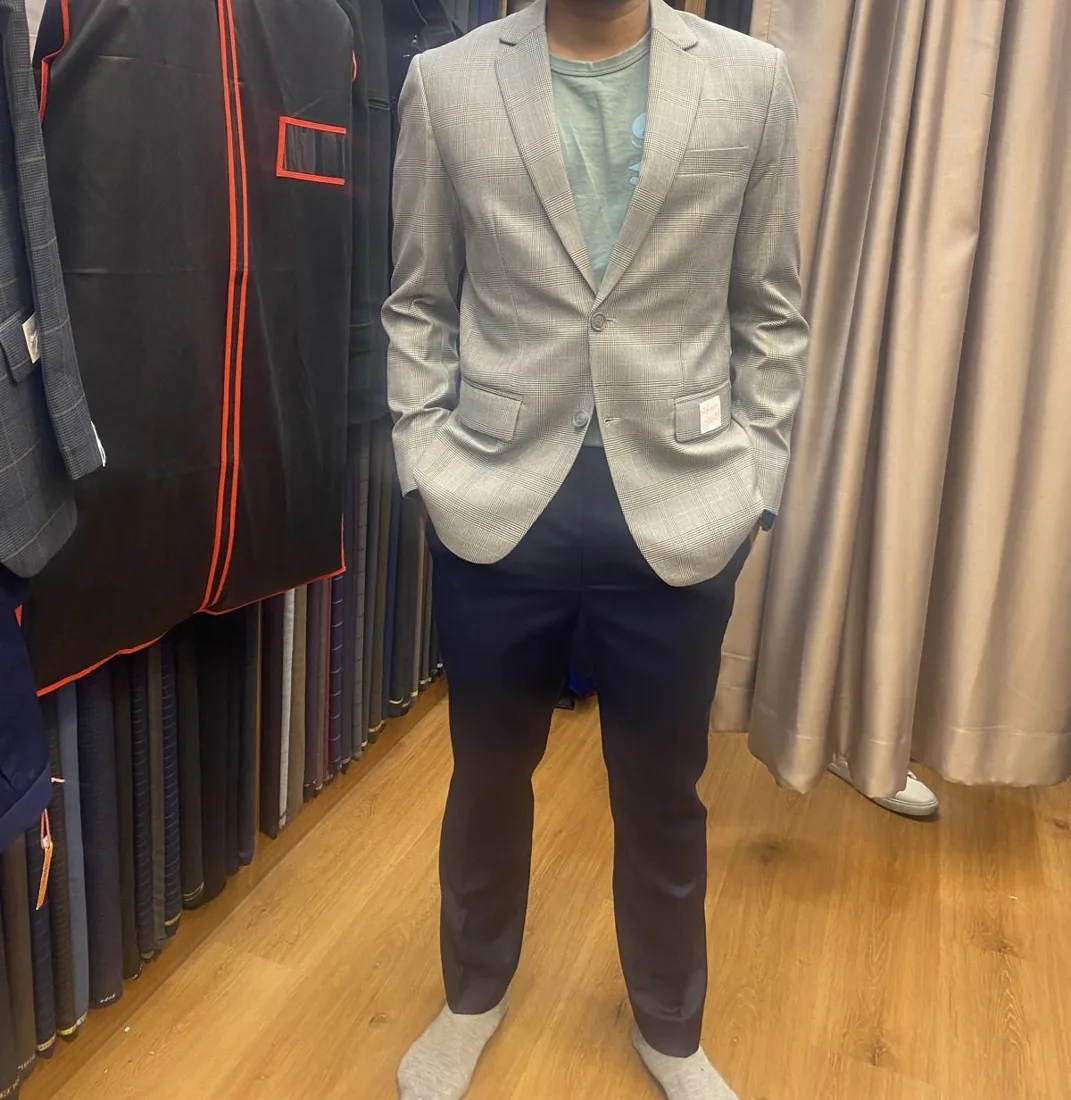 Client in a light-grey tailored blazer