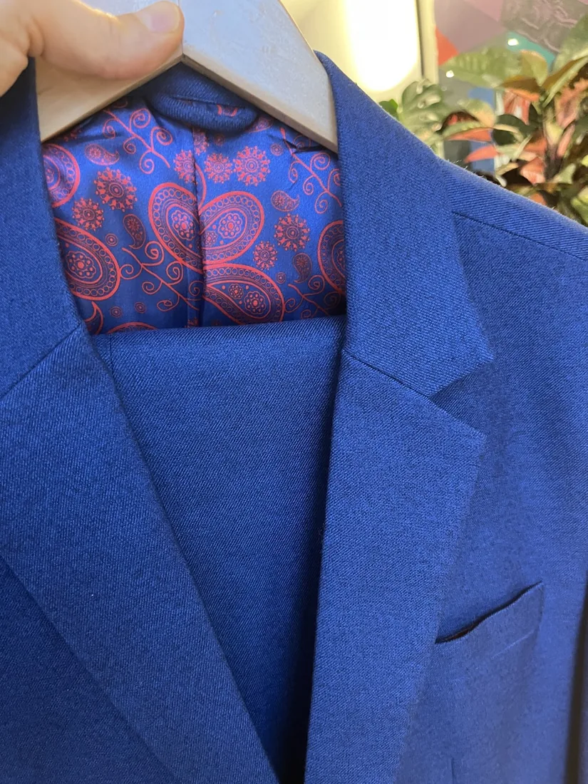 Close-up of a blue wool lapel with paisley lining