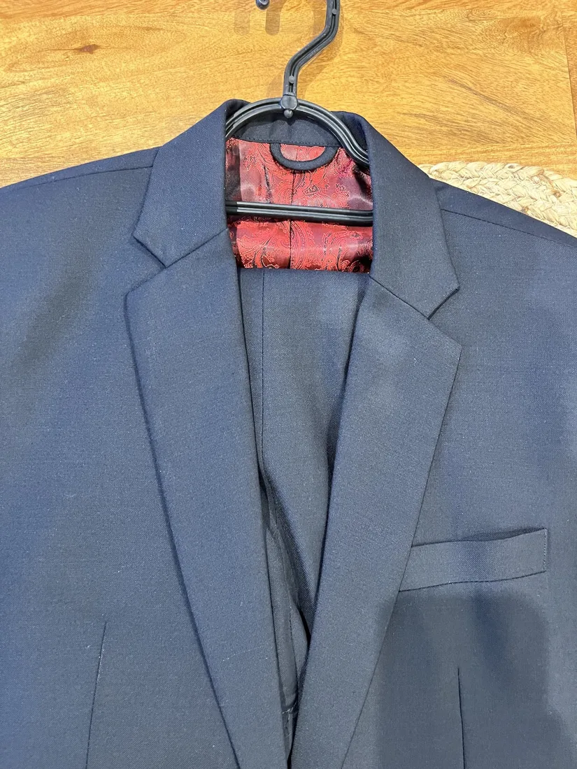 Bespoke navy jacket with red silk lining