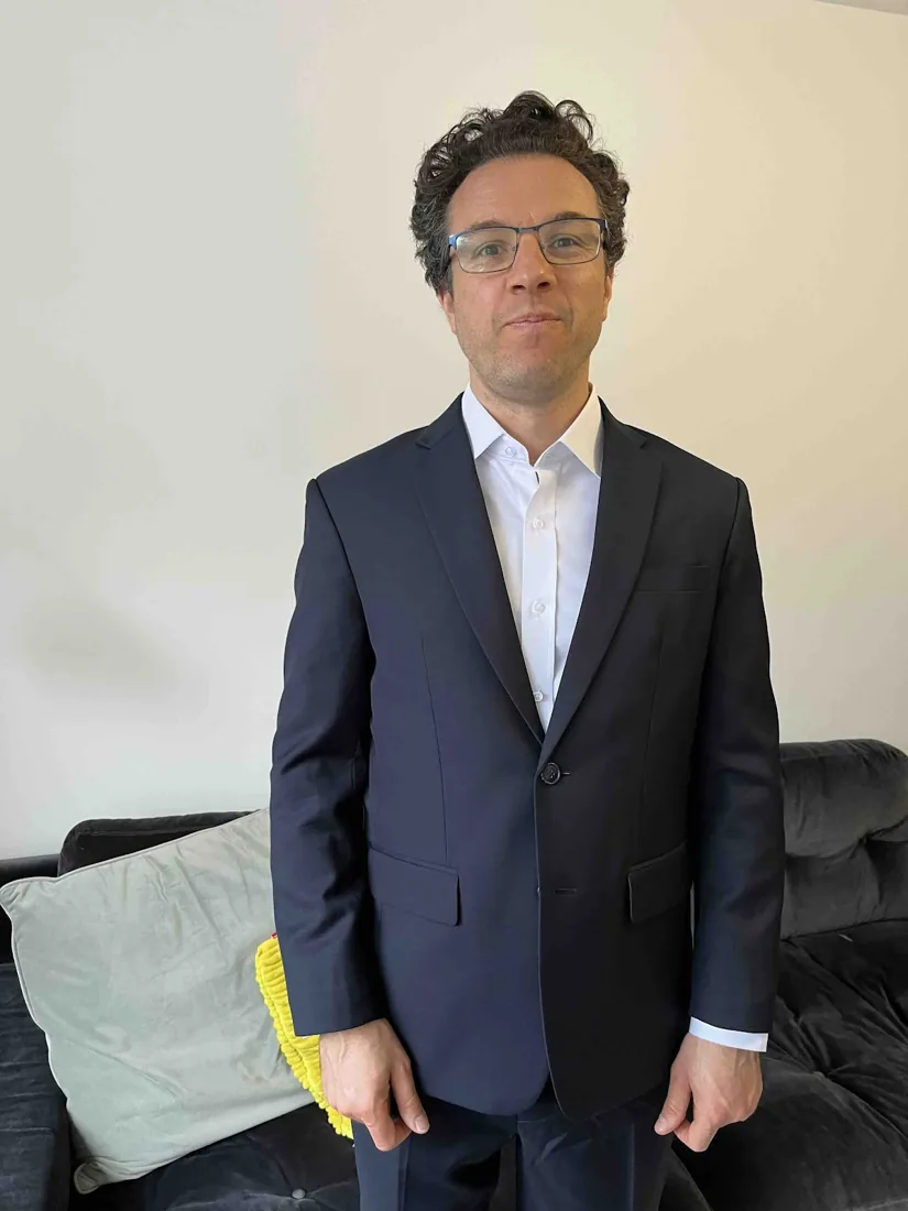 Michael Arnold in a bespoke suit by G.Armani Suit